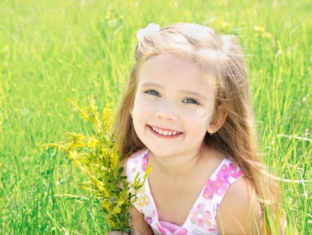 21199263-cute-little-girl-on-the-meadow-with-flowers-in-summer-day-stock-photo1